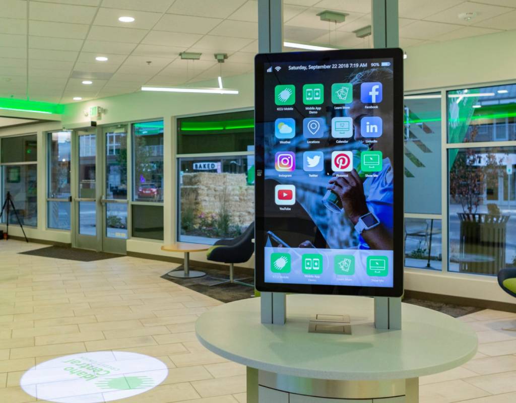 A display room with a giant iphone monitor