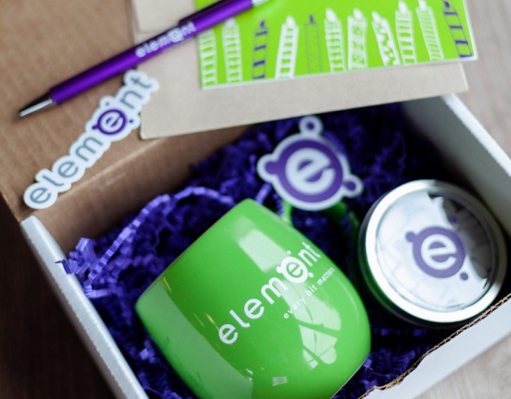 A box full of promotional gifts with the element logo.