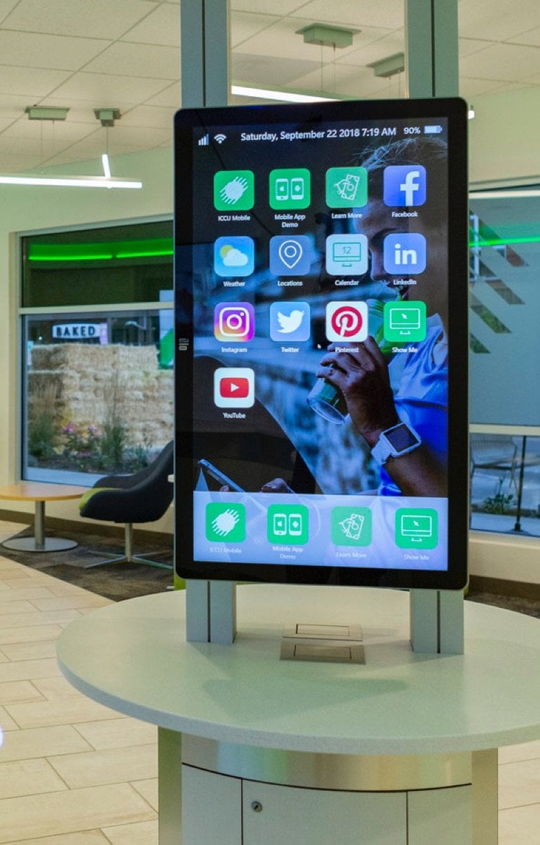 A display room with a giant iphone monitor