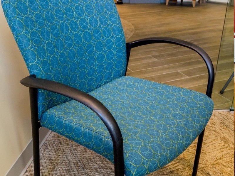 A blue waiting room chair.