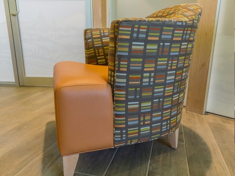 A multicolored upholstered chair.
