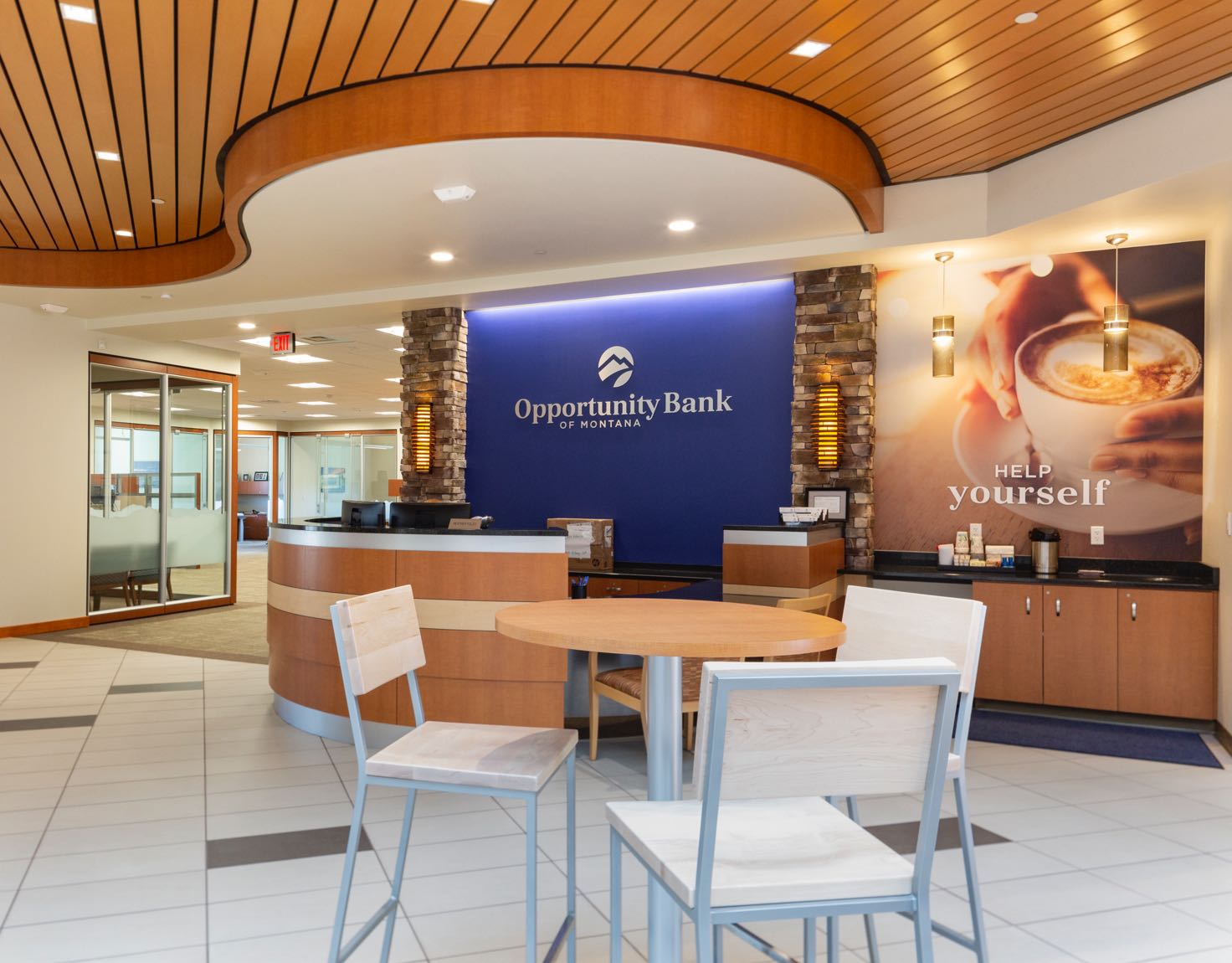 A waiting area in a bank with a self-serve coffee station.