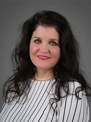 A woman in a white and black striped shirt.