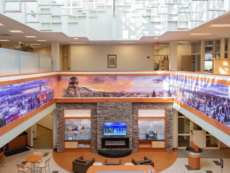 A bank lobby, from a second-floor, balcony view.