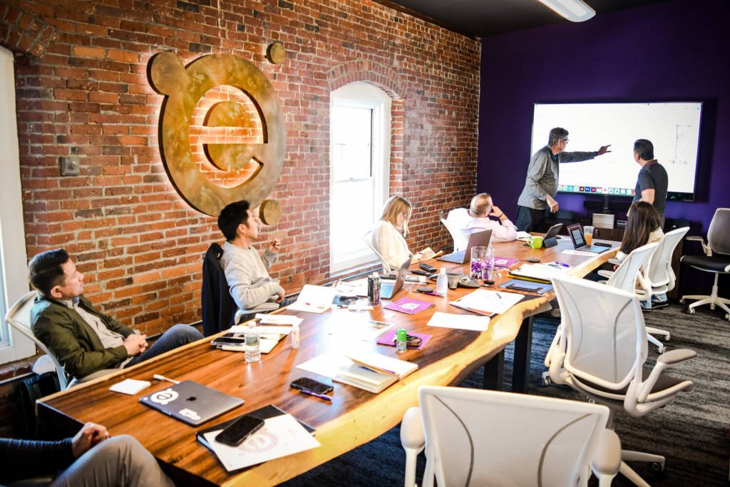 A group of coworkers meeting in a conference room.