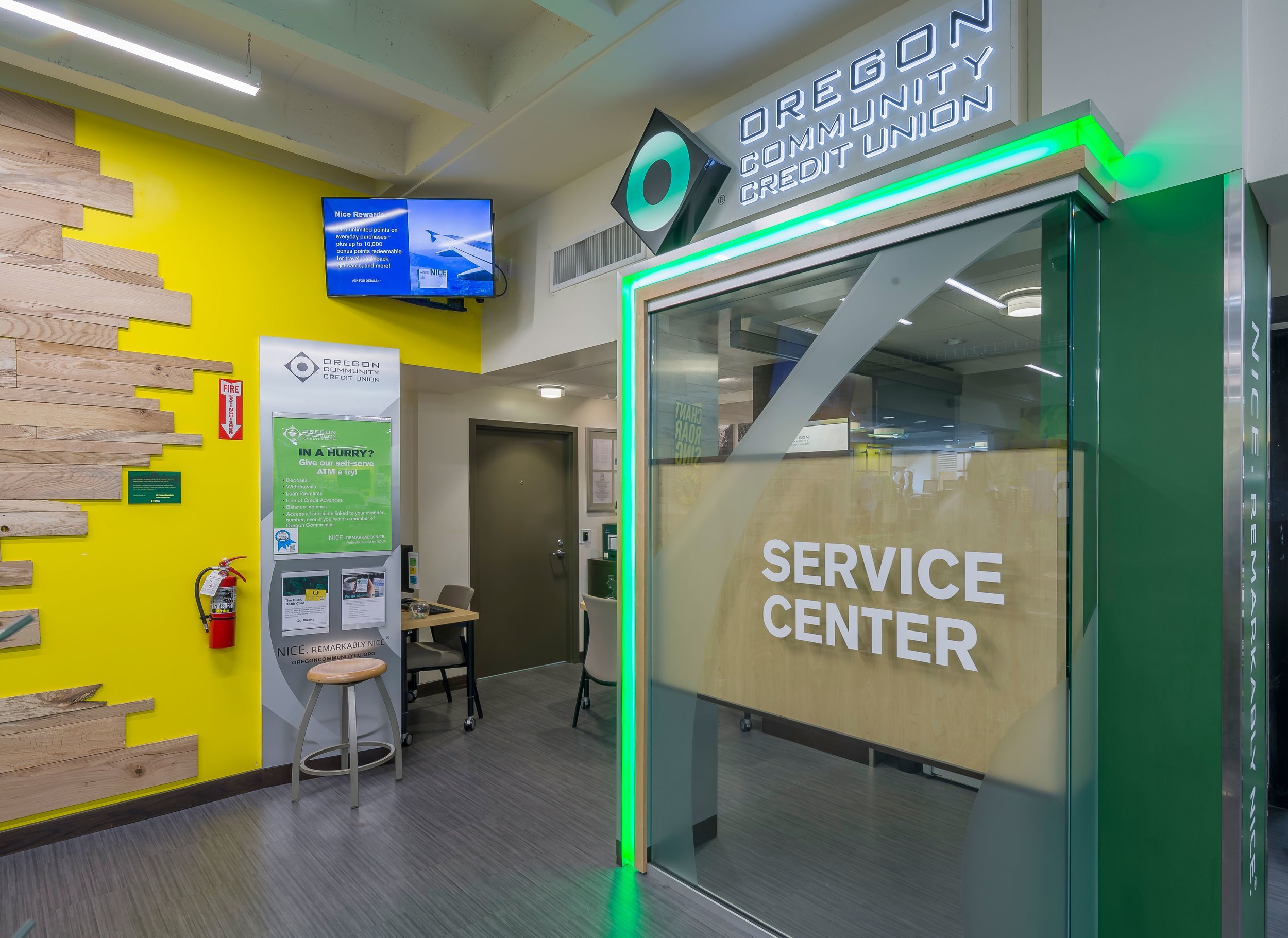 A service center with a desk and chairs on either side.