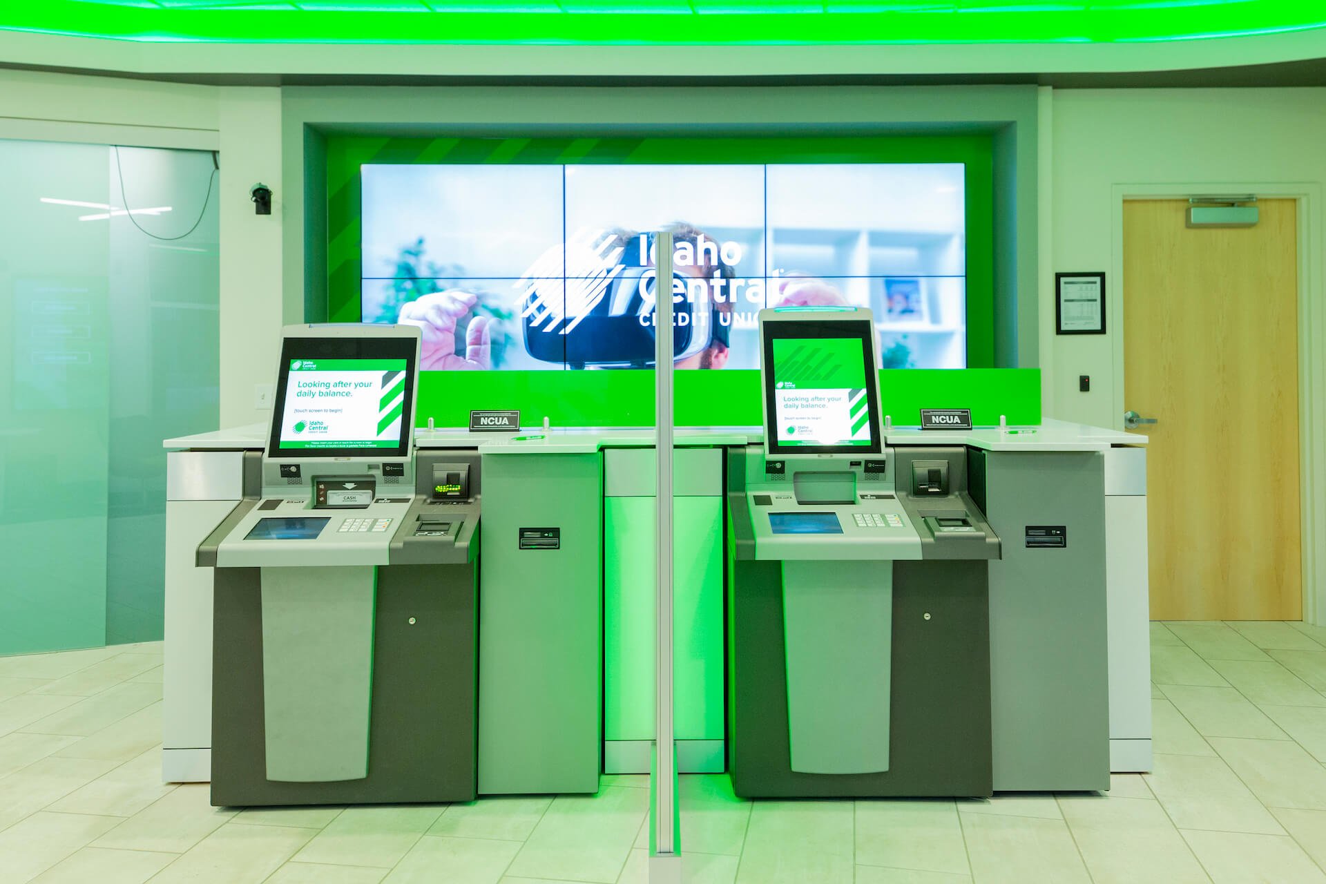 A sleek interactive banking setup with multiple digital service kiosks at Idaho Central Credit Union.