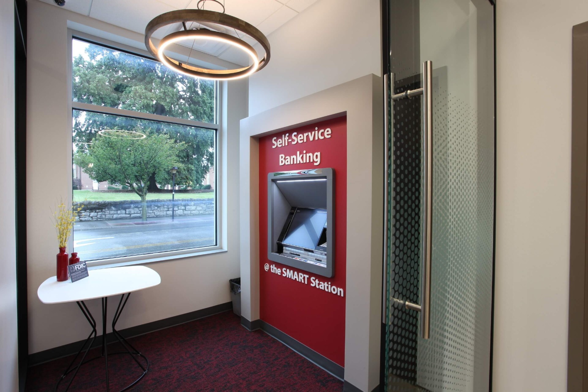 An interactive banking teller machine equipped with a self-service kiosk for customer convenience.