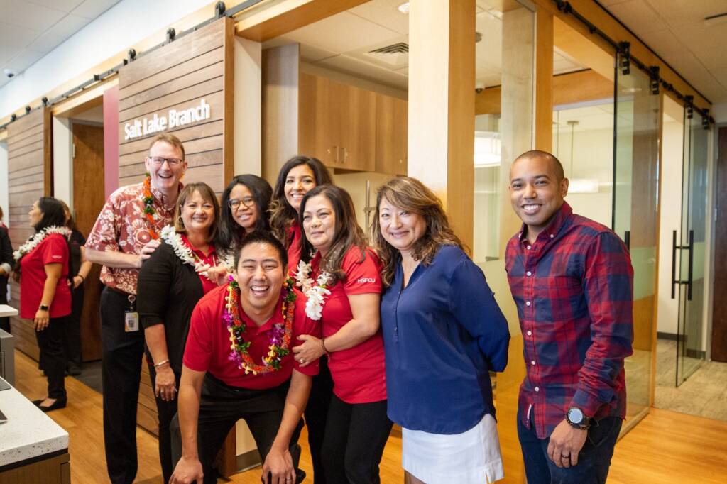 group of employees gathered around in the lobby of a bank