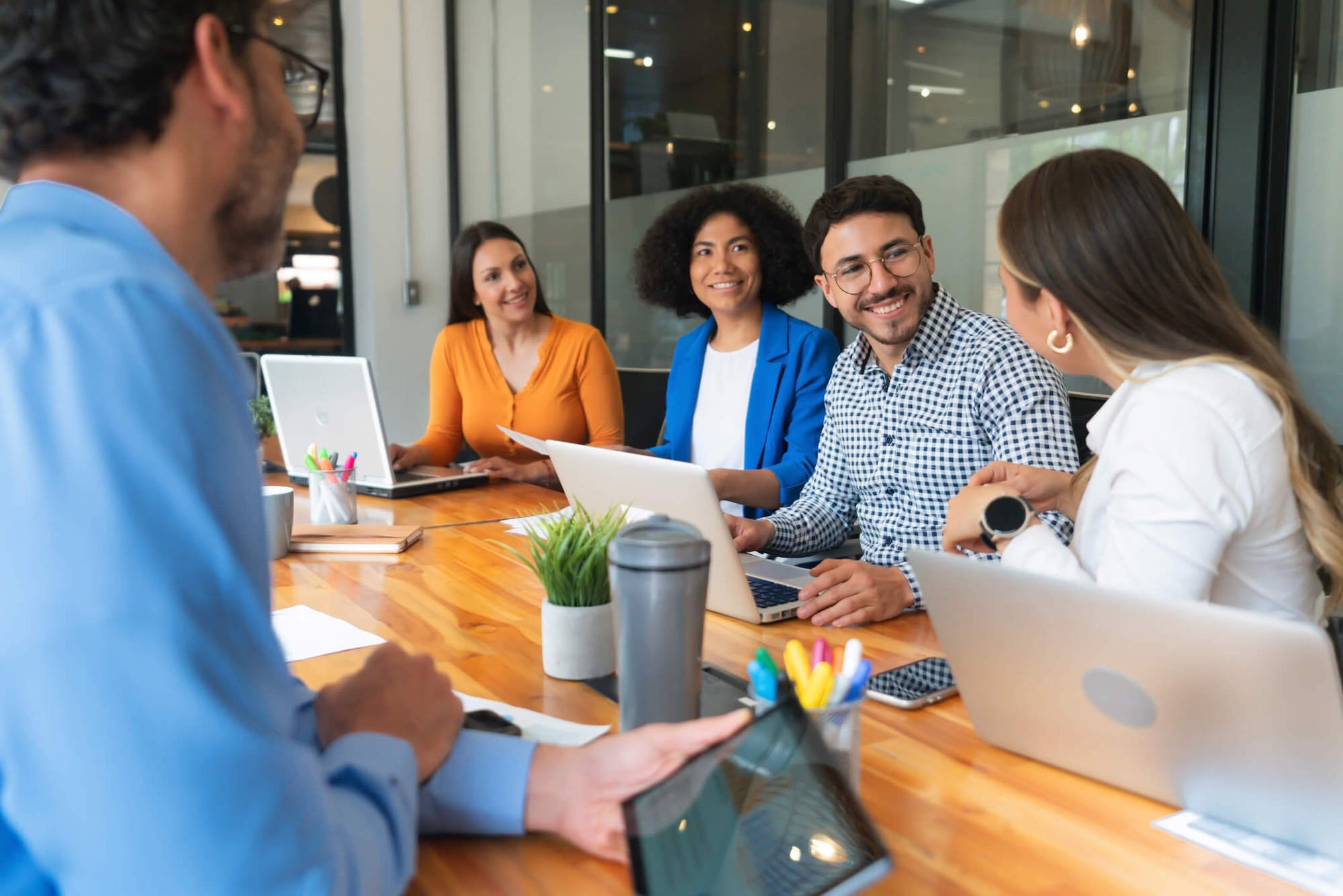 group of people talking around a table